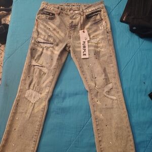 Trendy Light Blue Distressed Jeans with Paint Splatter